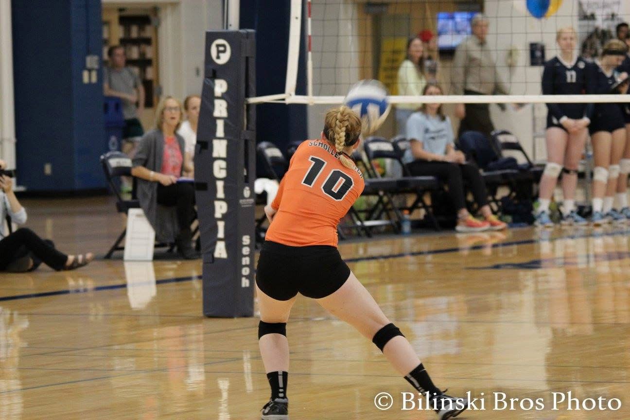 Jamie Bilinski making a defensive play for Greenville volleyball