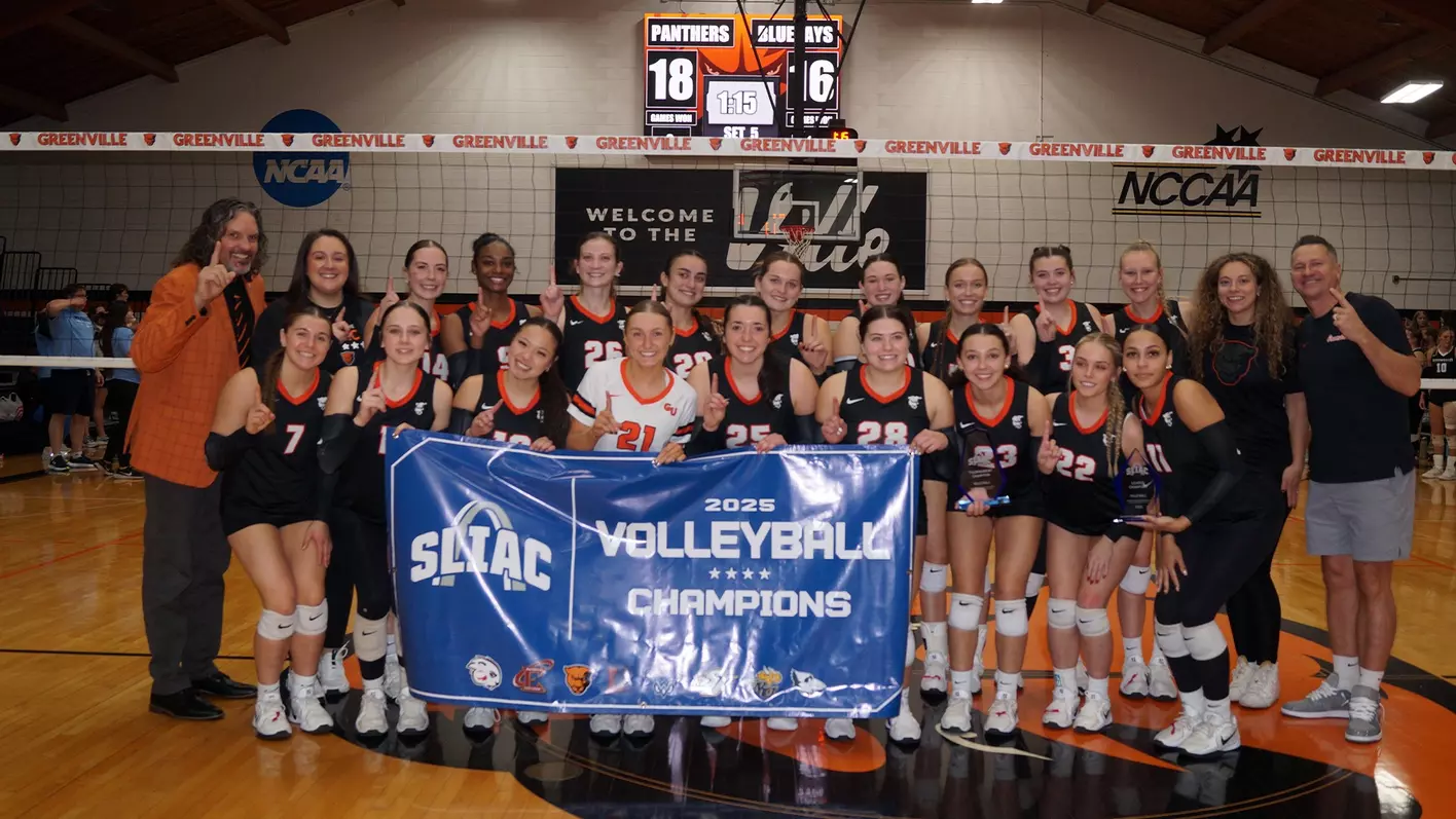2025 Greenville Panthers volleyball team and coaches celebrating with the SLIAC Champions banner at the net.